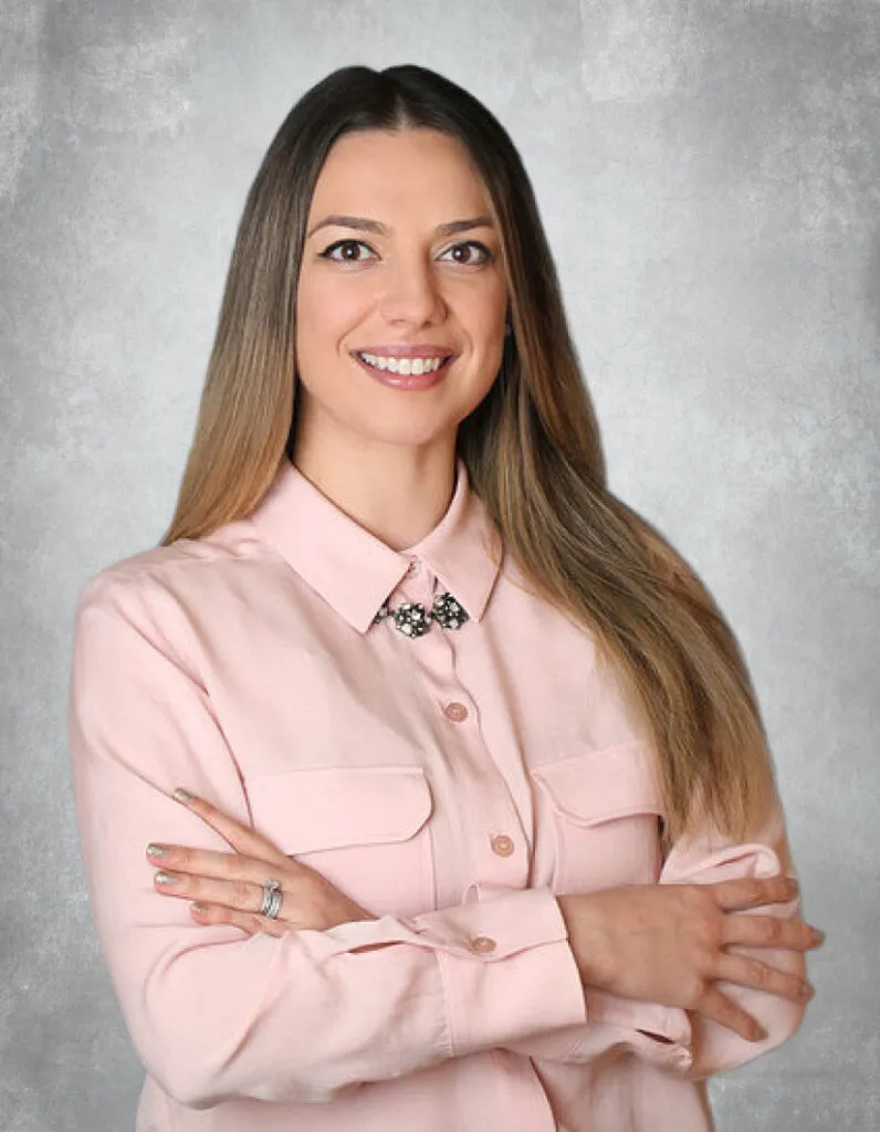 Portrait of female dentist smiling in professional attire