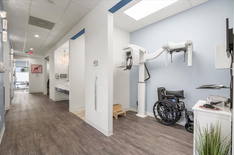 Modern dental office hallway showcasing advanced dental technology and patient care facilities