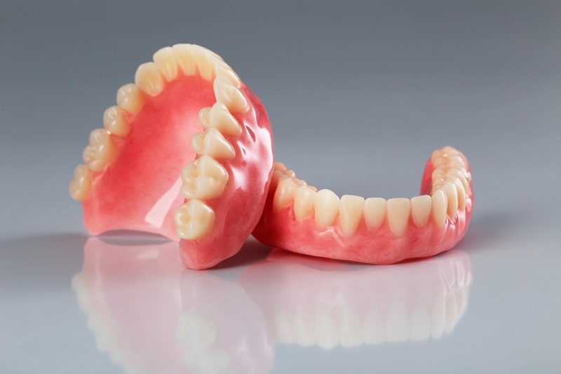 Complete set of dentures used to replace missing teeth