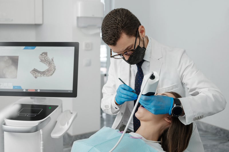 Dentist treating a patient during an Invisalign orthodontic consultation
